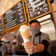 Disney World employee holding out ice cream cone